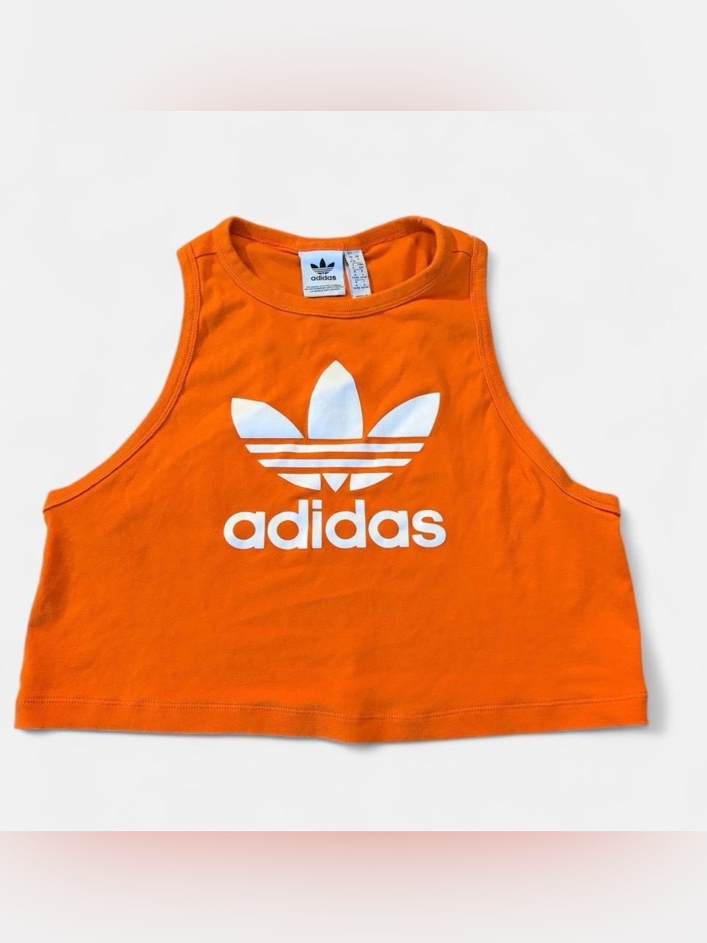 Adidas Women’s Sz. S sleeveless orange crop top with the classic white Trefoil